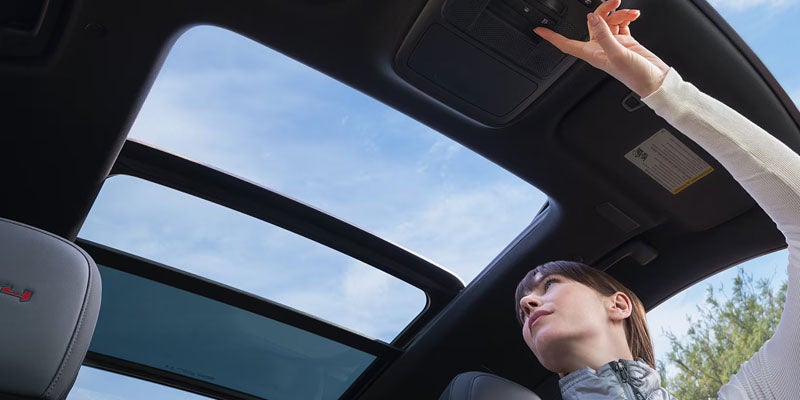 2026 GMC Acadia panoramic sunroof interior view.